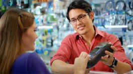 Customer Paying With Credit Card In Chinese Computer Shop.jpg Customer Paying With Credit Card In Chinese Computer Shop.jpg
