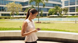 Happy Business Woman Talking On Mobile Phone Walking.jpg Happy Business Woman Talking On Mobile Phone Walking.jpg