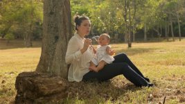 Mother Playing Soap Bobbles With Little Baby Daughter In Park On Grass.jpg Mother Playing Soap Bobbles With Little Baby Daughter In Park On Grass.jpg
